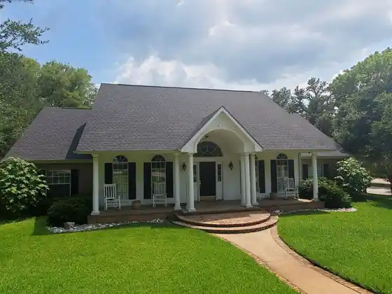 Home with a columned porch and a new roof