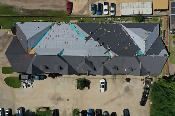 Commercial strip building mid re-roof with half of the roof done