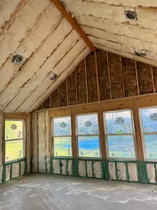 Vaulted gable room with spray foam insulation during a rebuild