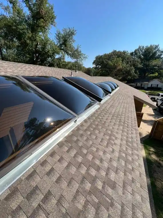 A row of skylights set into new shingles